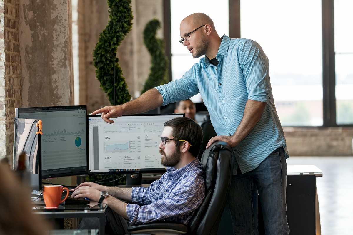 Two St. Louis Web Design Company developers performing site maintenance.